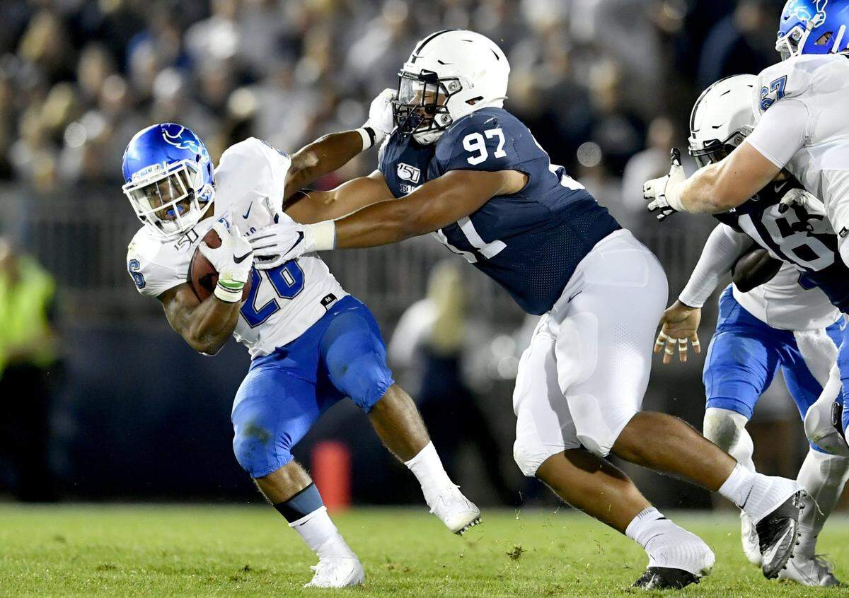 Penn State’s PJ Mustipher pulls down Buffalo’s Jaret Patterson during the game on Saturday Sept. 7, 2019.