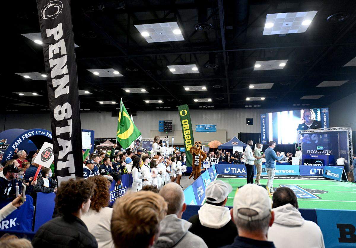 Penn State fans gather around the Big Ten Tailgate show at the Indianapolis Convention Center before the game on Saturday, Dec. 7, 2024.