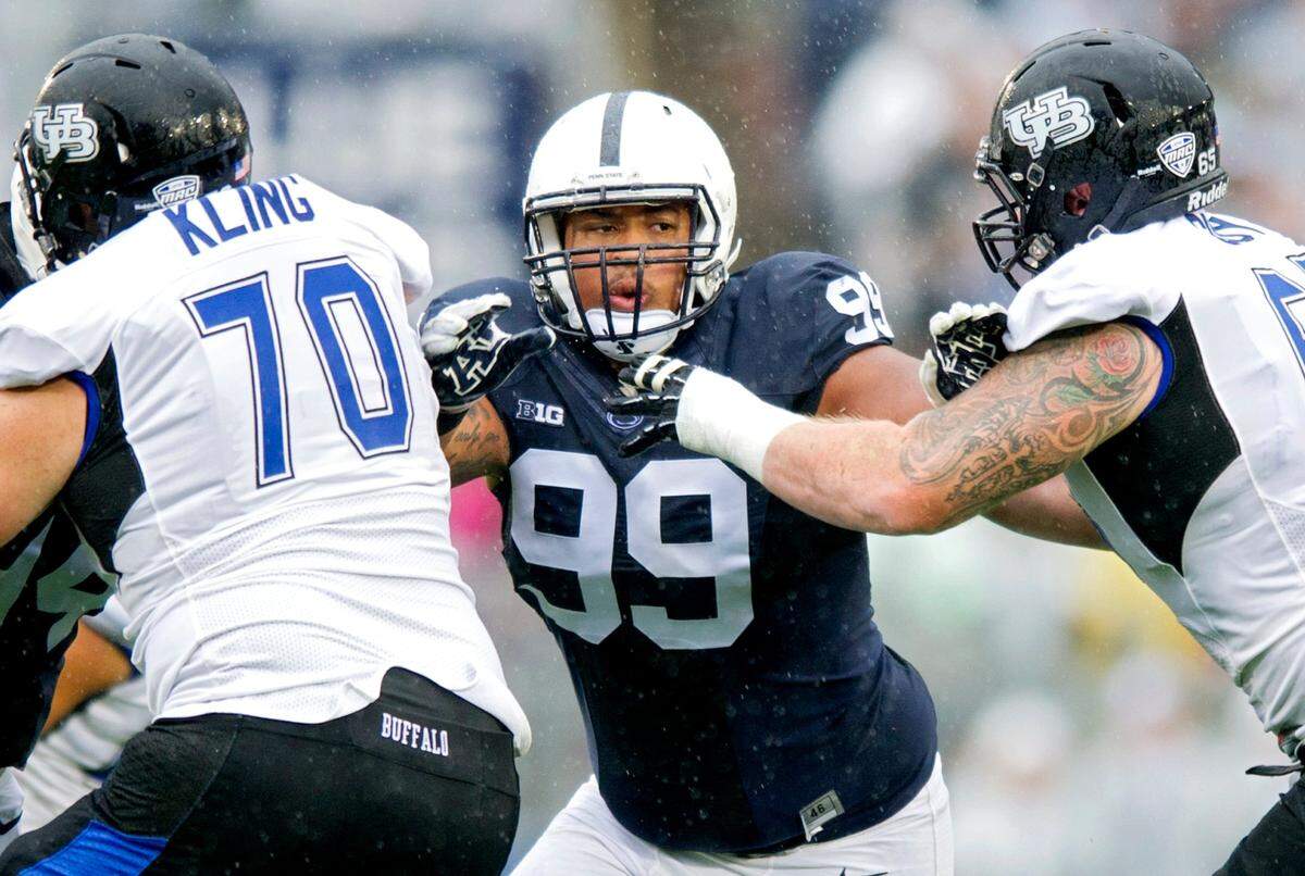 Penn State defensive tackle Austin Johnson pushes through Buffalo defenders during the Saturday, September 12, 2015 game at Beaver Stadium. Penn State won, 27-14.