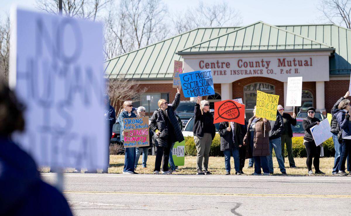 Protesters lined both sides of Benner Pike outside of U.S. Rep Glenn “GT” Thompson’s office to show their disapproval of his actions in Washington D.C. on Tuesday, March 18, 2025.
