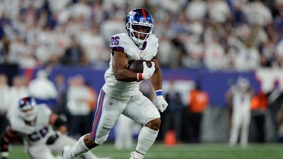 New York Giants running back Saquon Barkley runs for a touchdown against the Dallas Cowboys during the third quarter Monday in East Rutherford, N.J.