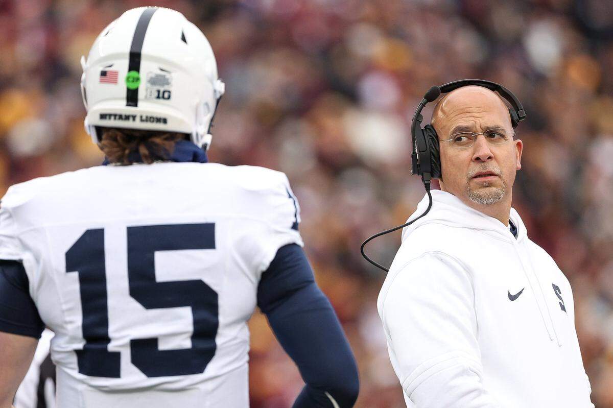 Nov 23, 2024; Minneapolis, Minnesota, USA; Penn State Nittany Lions head coach James Franklin looks at quarterback Drew Allar (15) during the first quarter against the Minnesota Golden Gophers at Huntington Bank Stadium. Mandatory Credit: Matt Krohn-Imagn Images