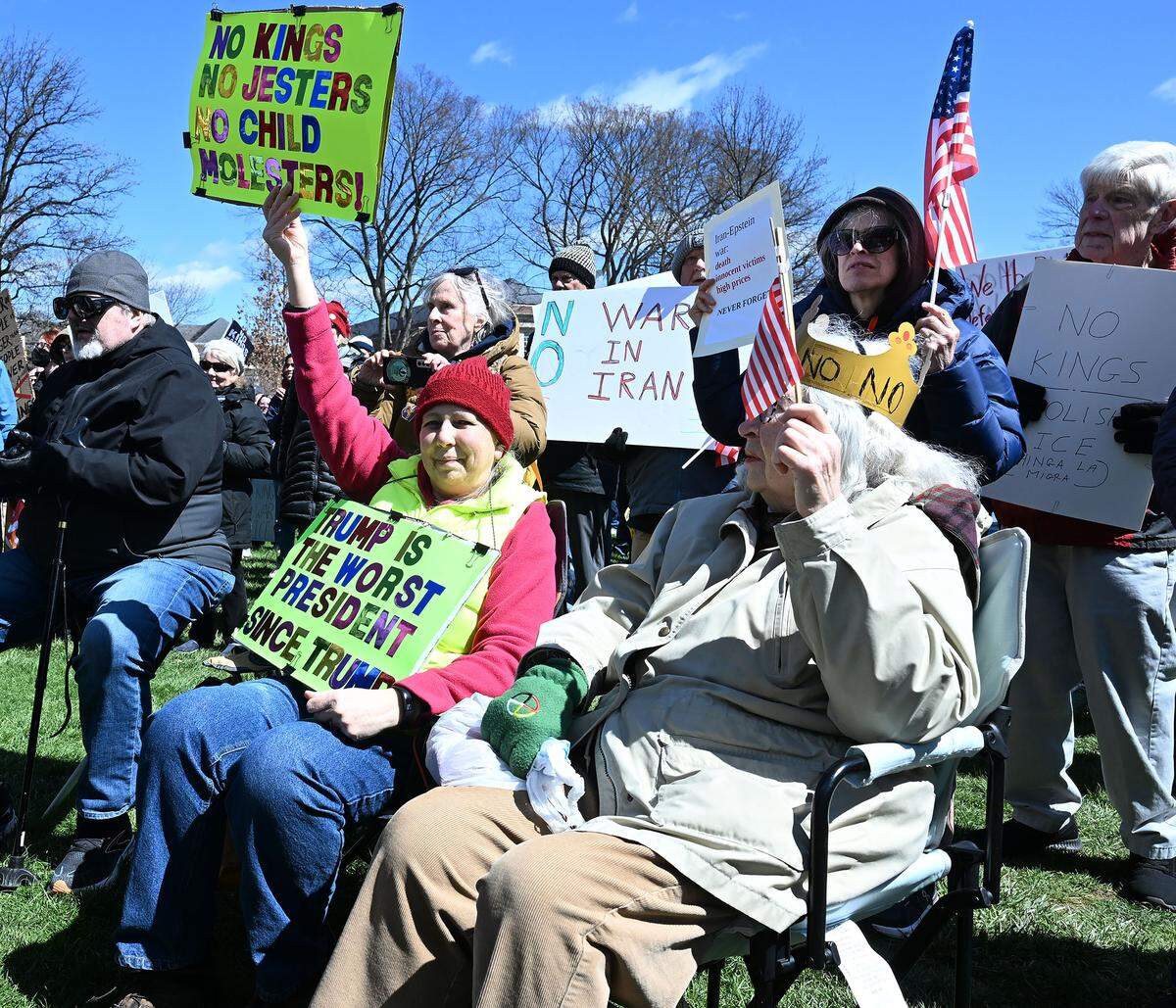 Thousands of people, many carrying signs, gathered on Old Main lawn for the No Kings anti-Trump rally on Saturday.