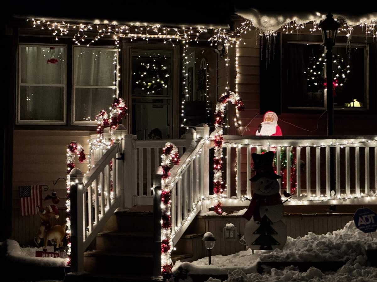 White lights run along the railings and roof of 330 Flat Rock Road, Port Matilda on Dec. 3, 2025
