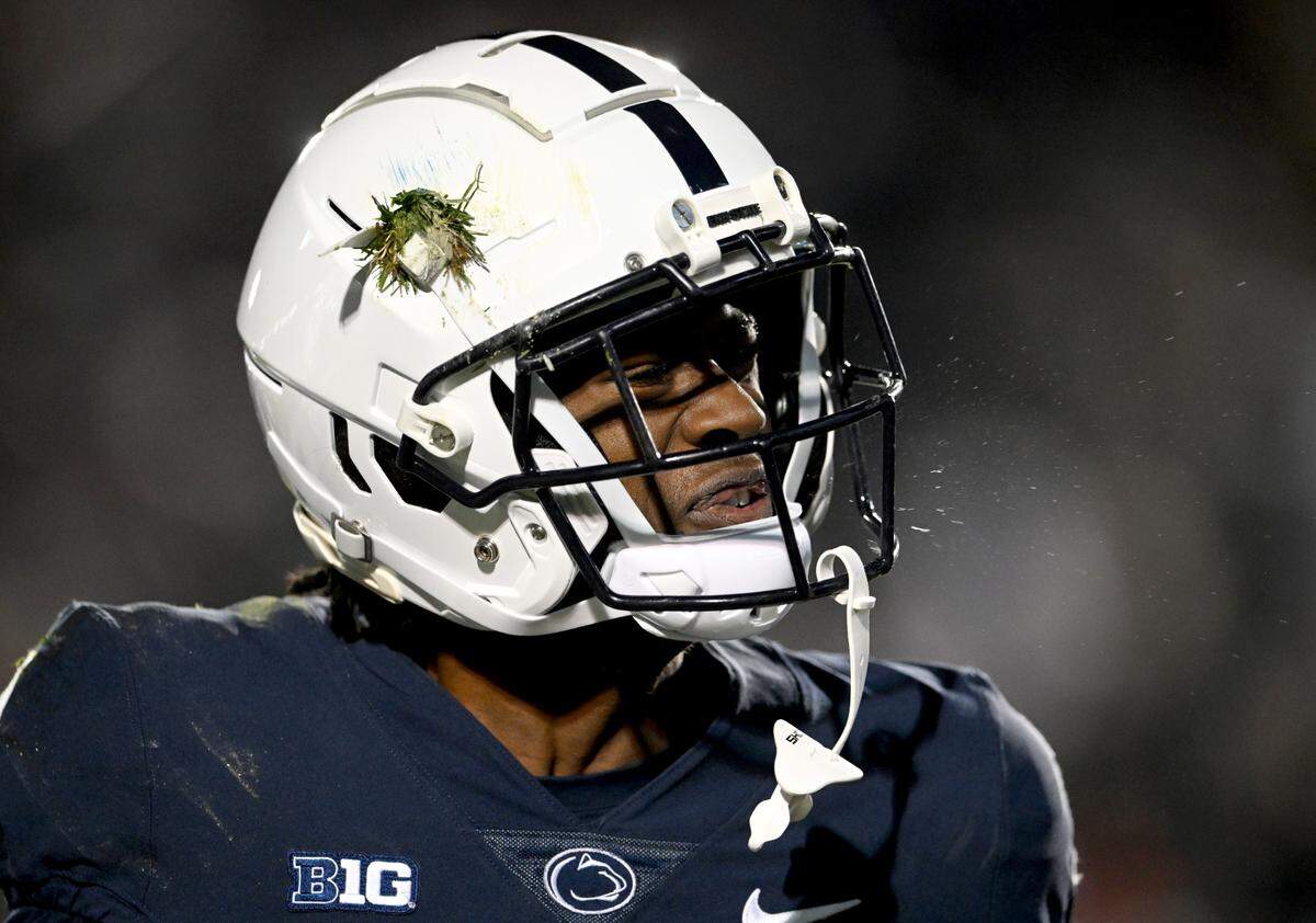 With grass still stuck to his helmet Penn State wide receiver KeAndre Lambert-Smith celebrates his touchdown during the game against Michigan State on Saturday, Nov. 26, 2022.