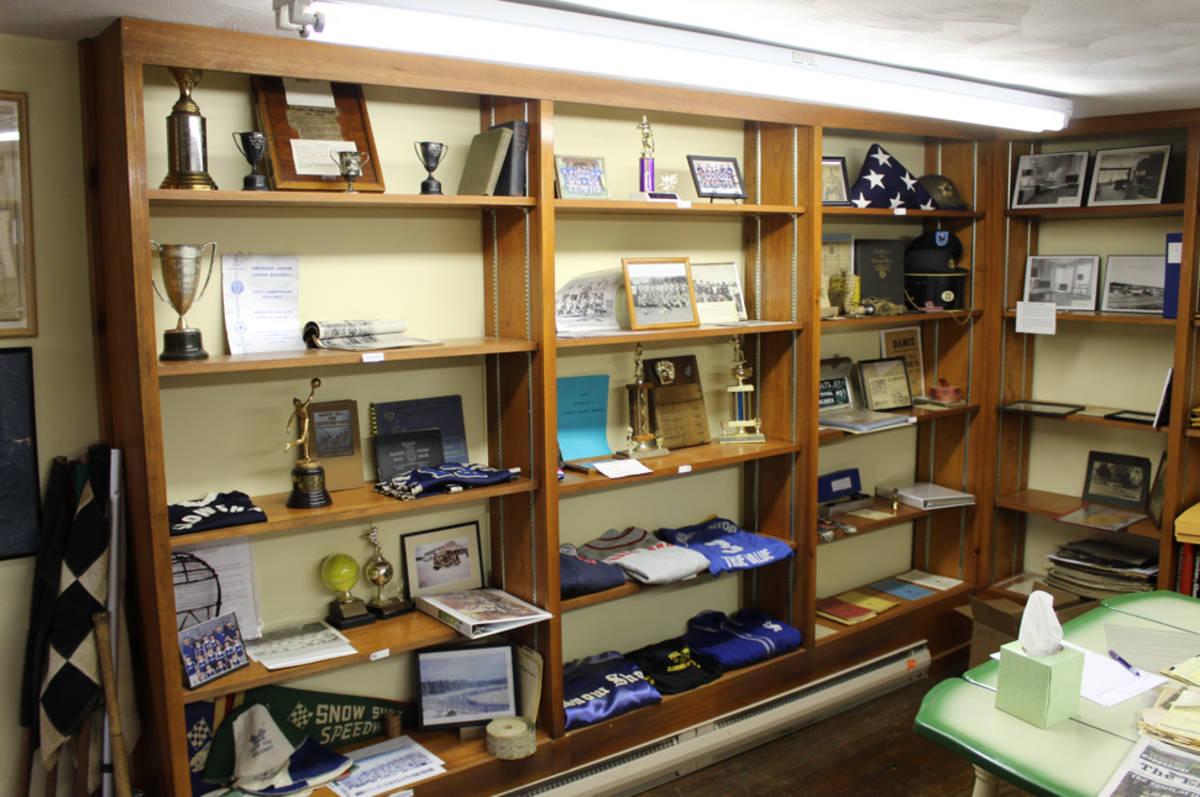 A shelf displaying local sport memorabilia at the David House Heritage Museum.