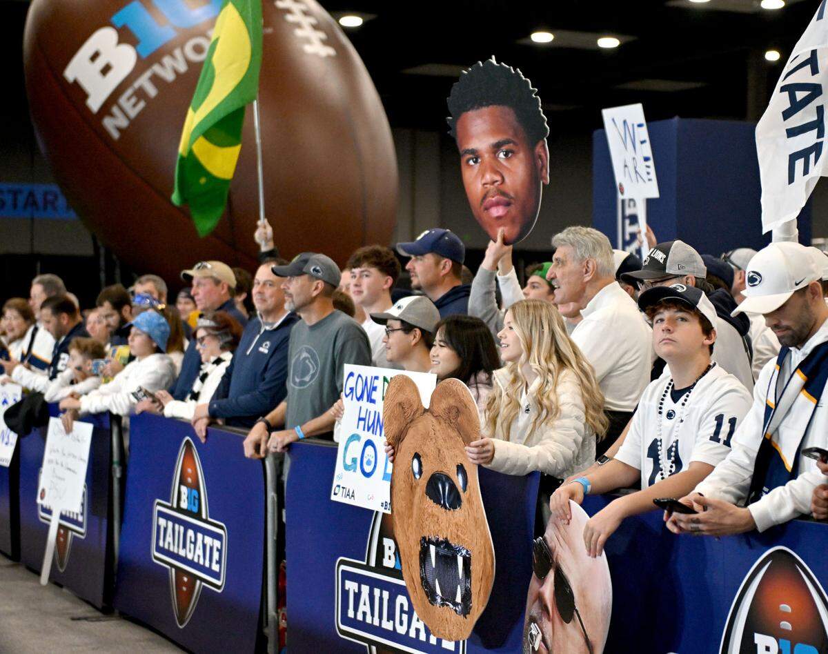 Penn State fans gather around the Big Ten Tailgate show at the Indianapolis Convention Center before the game on Saturday, Dec. 7, 2024.