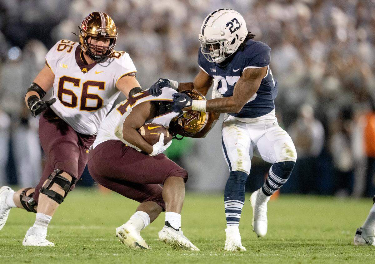 Penn State linebacker Curtis Jacobs stops Minnesota’s Mohamed Ibrahim during the game on Saturday, Oct. 22, 2022.