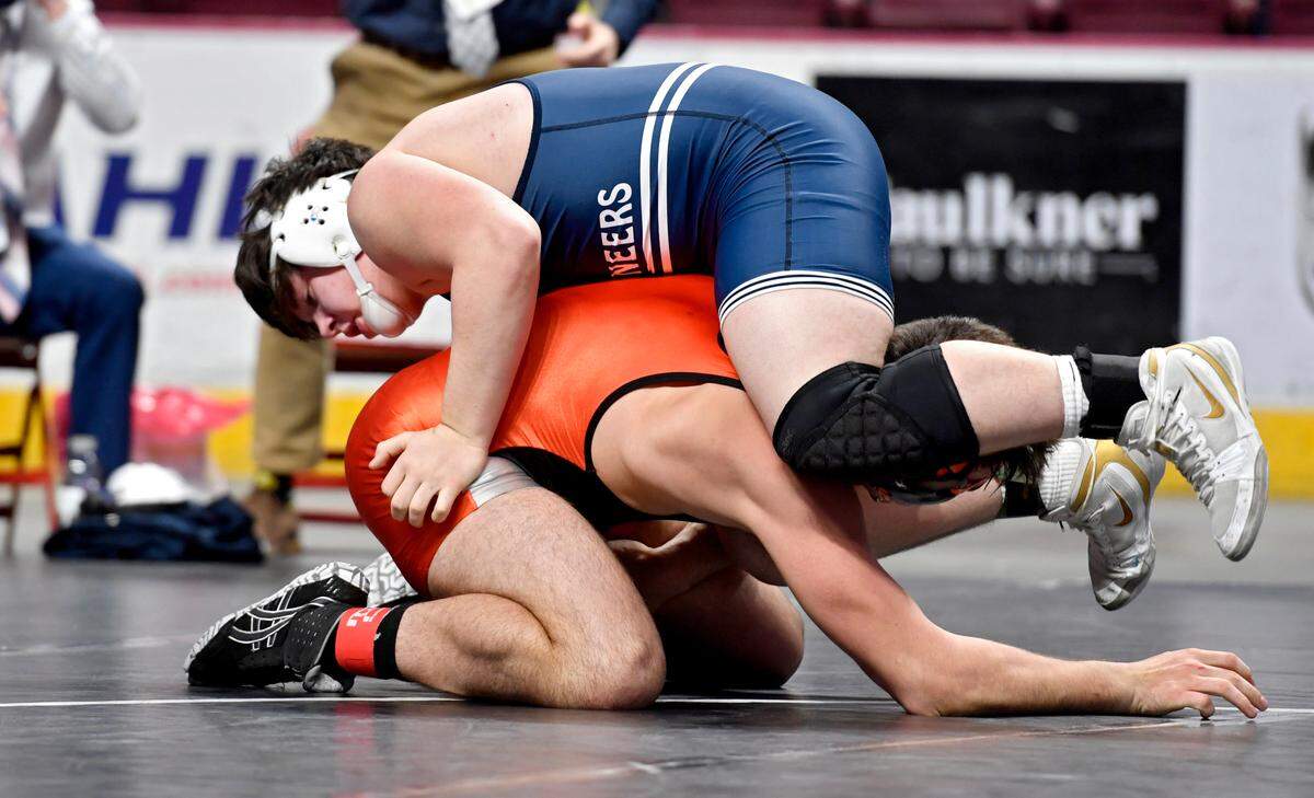 Philipsburg-Osceola’s Parker Moore wrestles Corry’s Hayden Linkerhof in the 215 lb seventh place bout at the PIAA AA wrestling championships on Friday, March 12, 2021 at the Hershey Giant Center.