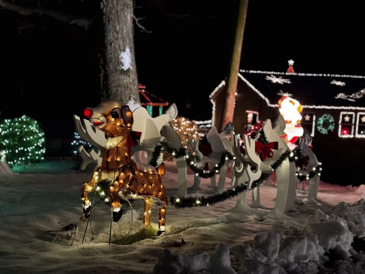 Rudolph, bound to the other reindeer with garlands, pulls Santa’s sleigh at 510 Flat Rock Road, Port Matilda on Dec. 3, 2025