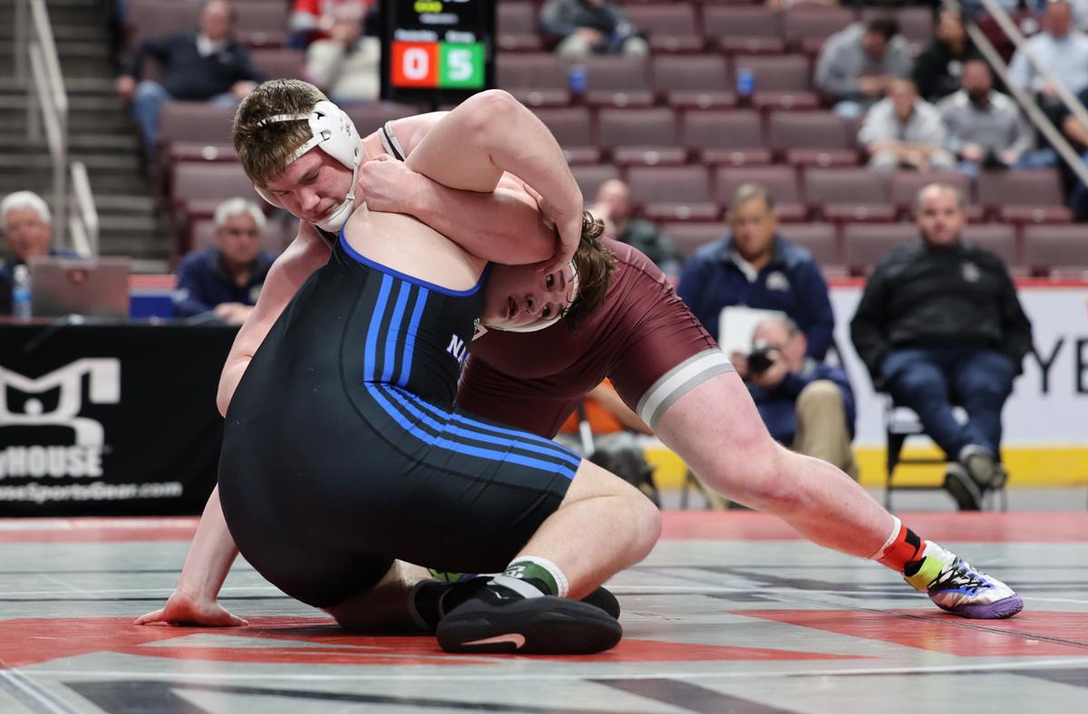 State College’s Nick Pavlechko fights off a shot from Nazarath’s Sean Kinney in their 285-pound finals match of the PIAA Class 3A Championships on Saturday, March 11, 2023 at the Giant Center in Hershey. Kinney shut out Pavlechko, 7-0.
