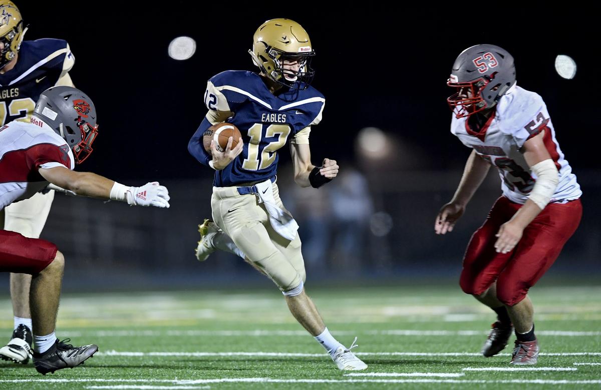 Central defenders try to stop Bald Eagle Area’s Jaden Jones on the quarterback keep during the game on Friday, Spet. 20, 2019.