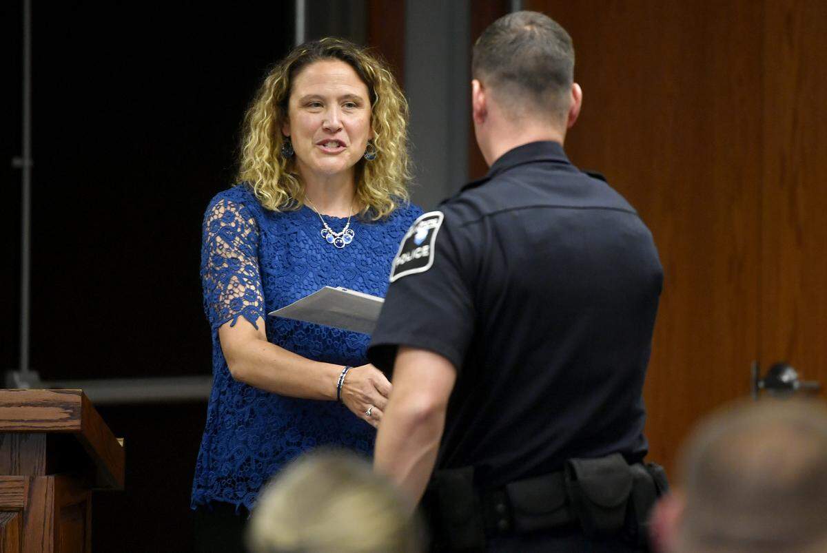 Centre County Crisis Intervention Team coordinator Tracy Small congratulates a Penn State Police officer at a training graduation on June 28. Within Penn State police, 98% of full-time, sworn officers at University Park have received CIT training.