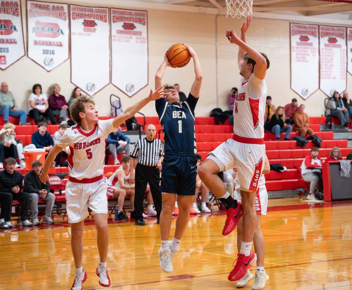 Bald Eagle Area senior Jackson Millward (1) goes up for a contested layup during a Monday night basketball game against Bellefonte in Bellefonte, Pa., on Monday, Feb. 9, 2026. The Eagles beat the Red Raiders 48-40.
