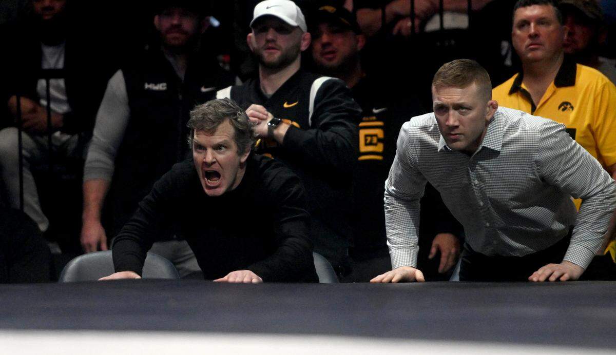 Iowa wrestling coach Tom Brands yells to Nelson Brands during the match against Penn State at the Bryce Jordan Center on Friday, Jan. 27, 2023.