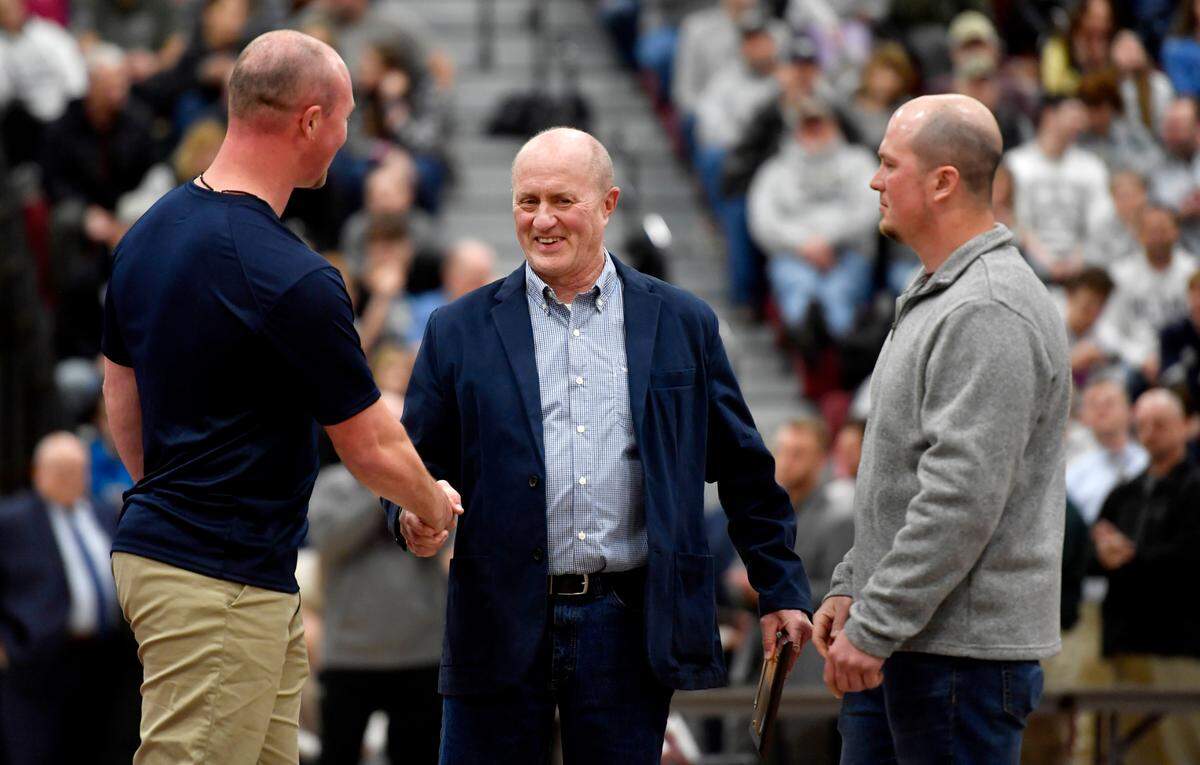 Former Philipsburg-Osceola coach Tim McCauley is congratulated by his sons after being inducted into the District 6 2A Hall of Fame on Saturday, Feb. 19, 2022.