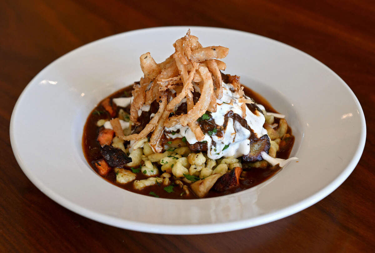 The Poe Paddy Porter Braised Beef with roasted carrots, Spaetzel, horseradish cream and frizzled onion from Elk Creek Cafe + Aleworks