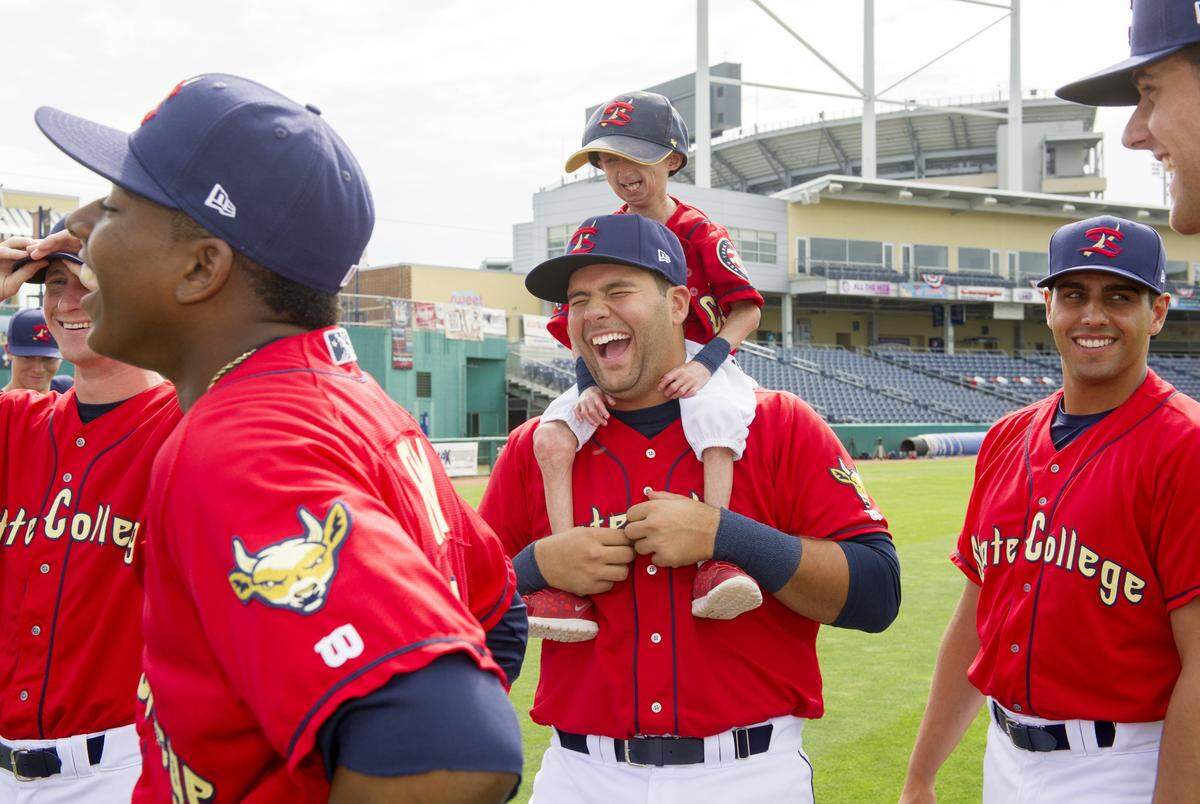 Josiah Viera laughs with Elier Rodriguez and fellow teammates as they joke around on Spikes media day on June 15, 2016.