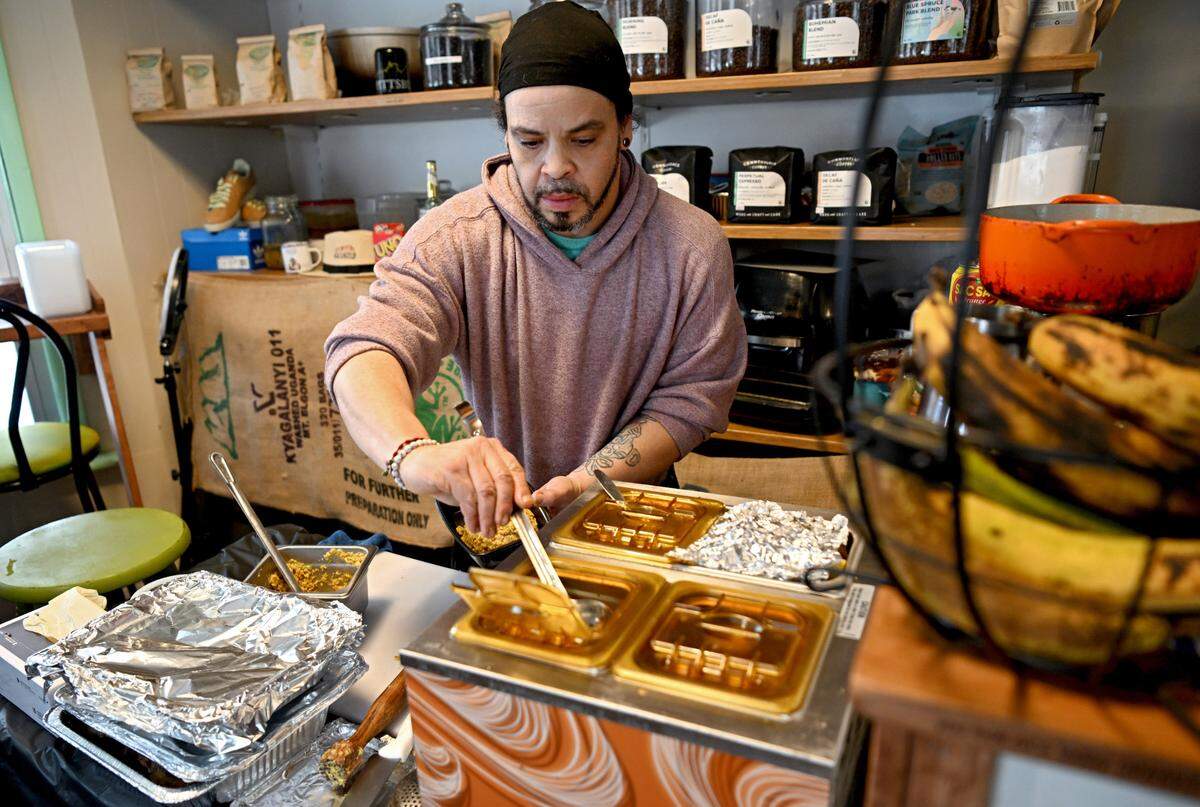 Angel Rodriguez makes an order of shrimp Mofongo at Coffee, Hemp and Tea on Saturday, Jan. 20, 2024.