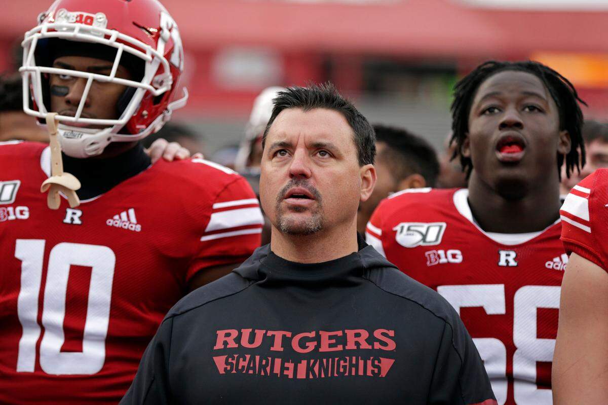 Rutgers interim head coach Nunzio Campanile stand with his players after losing to Michigan State 27-0 on Nov. 23 in Piscataway, N.J.