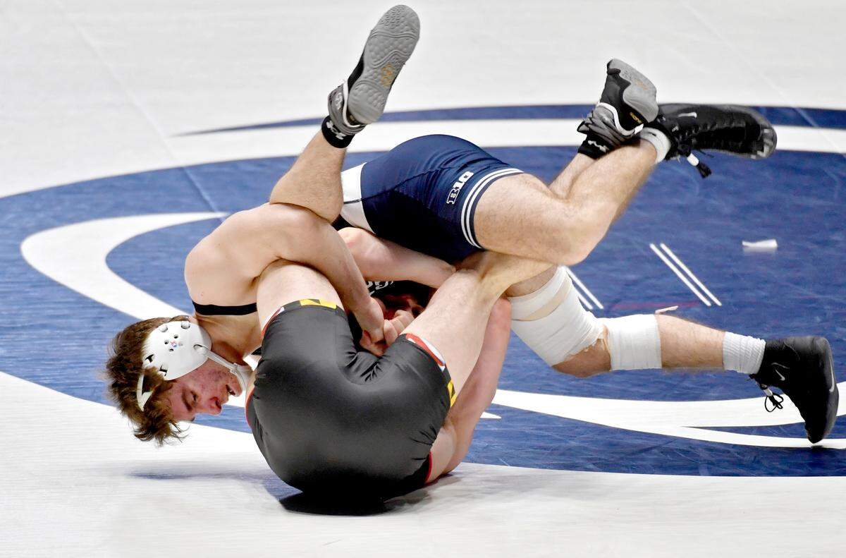 Penn State’s Joe Lee rolls Maryland’s Jonathan Spadafora in the 165-pound bout during the match on Monday, Feb. 22, 2021. Lee won by fall at 5:56.