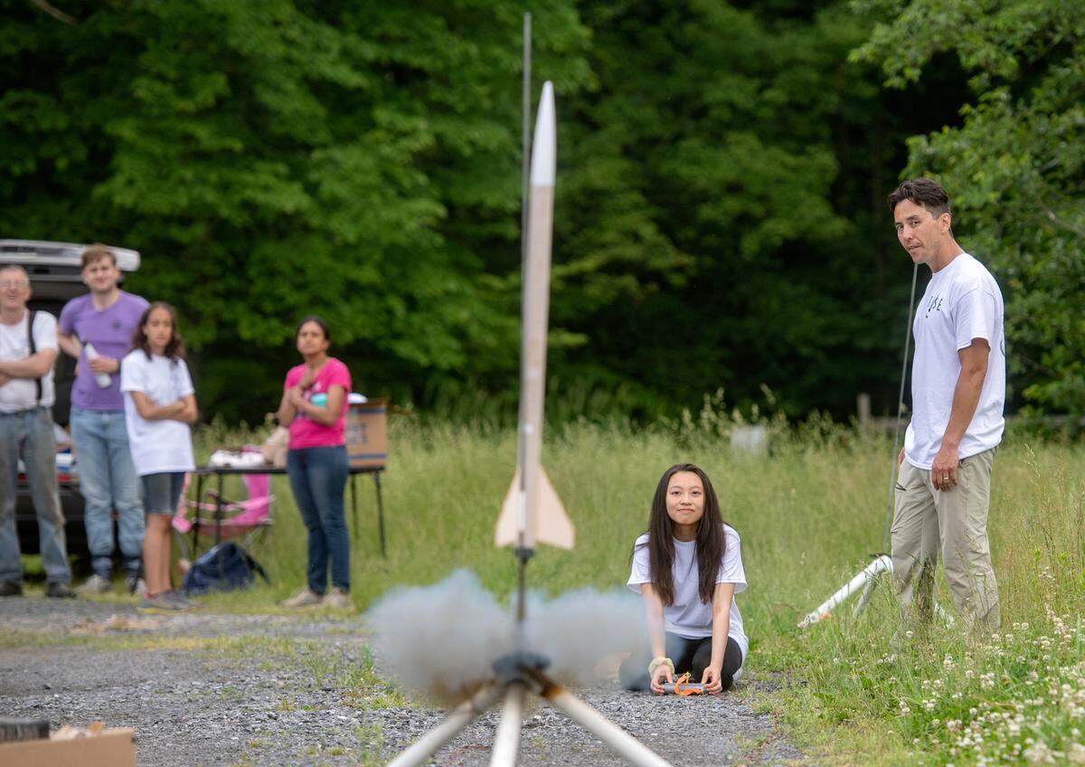 Krystal Nguyen watches as her rocket launches into the air on Thursday, June 2, 2022. Twenty State College students participated in Rockets for Inclusive Science Education through the school year, which culminated in a launch.