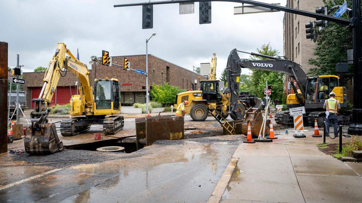 Construction crews work at the intersection of Atherton Street and Beaver Avenue in August.