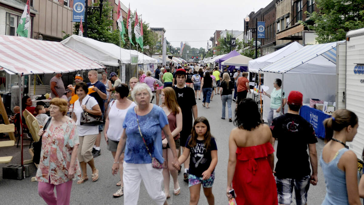 Visitors walk along through the food and craft vendors during the Philipsburg Heritage Days in July 2013.