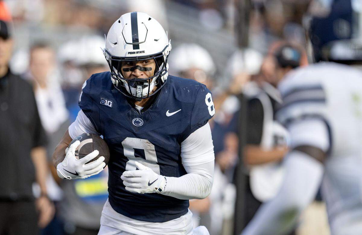 Penn State wide receiver Trebor Peña runs down the field with the ball from Nevada defenders during the game on Saturday, Aug. 30, 2025 at Beaver Stadium.