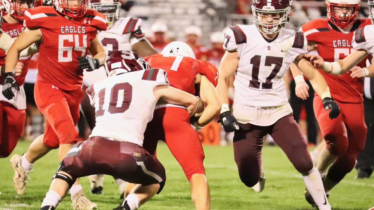 State College’s Jack Roeshot wraps up a Cumberland Valley ball carrier on Friday, Oct. 8, 2021. State College won, 21-18, in overtime.