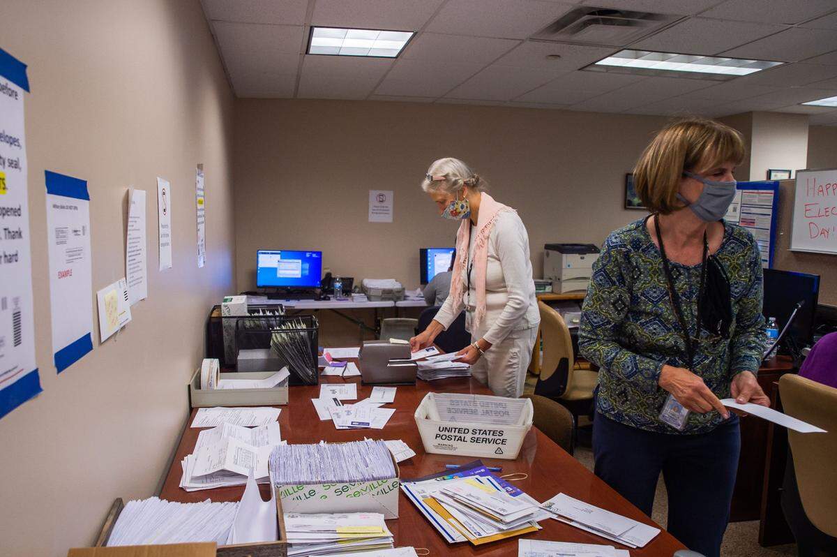Erie County employees are seen here organizing mail ballots during the 2020 presidential election. “We would have had to go to county taxpayers several times without this,” Erie County Executive Director Kathy Dahlkemper wrote of the grant money.