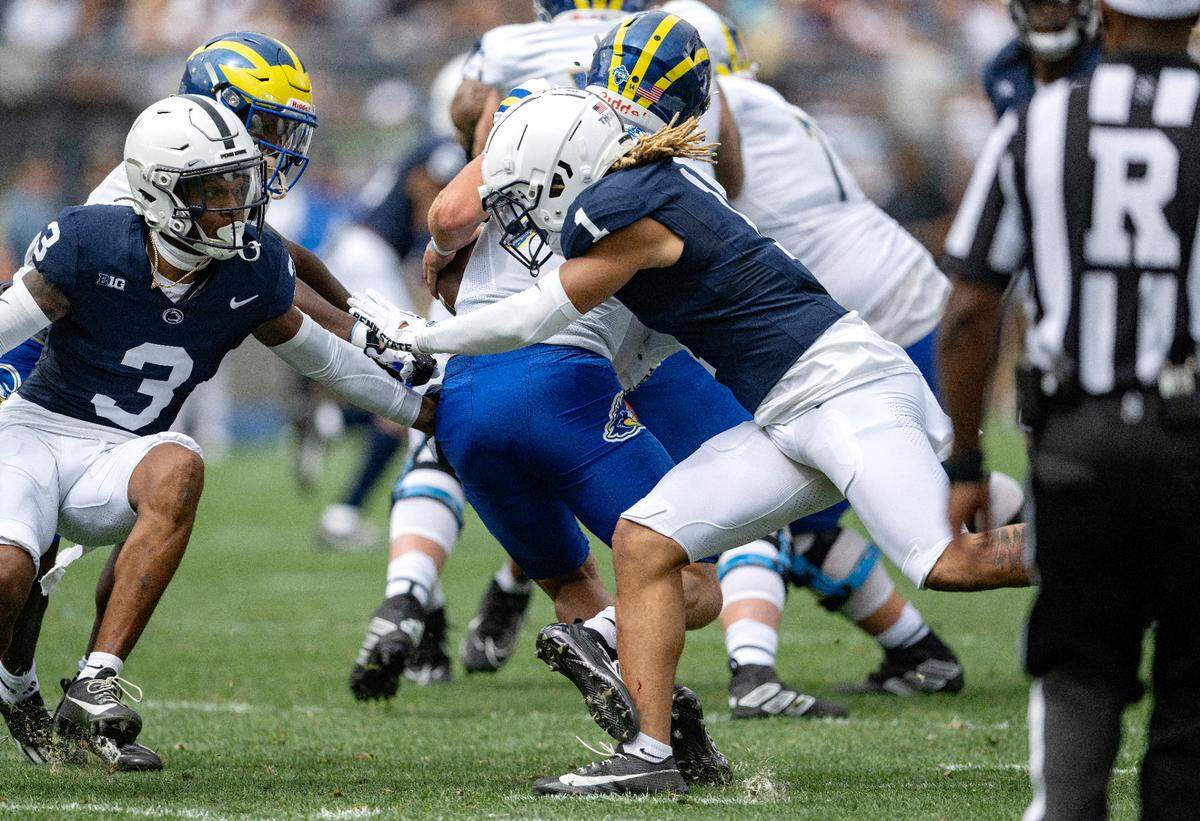 Penn State safety Jaylen Reed stops Delaware quarterback Ryan O’Connor during the game on Saturday, Sept. 9, 2023.