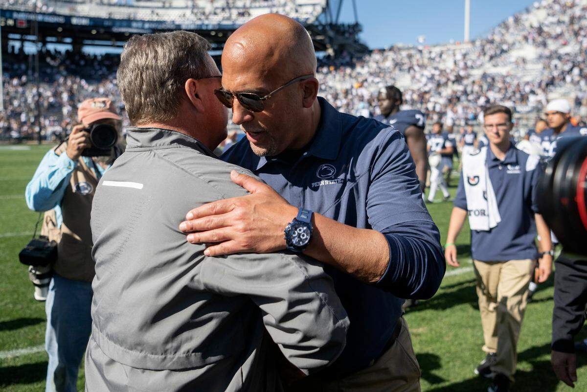 Penn State football coach James Franklin shakes hands with Central Michigan coach Jim McElwain after the game on Saturday, Sept. 24, 2022.