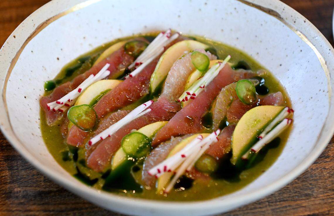 Yellow tail tuna, kiwi aqua chile, Anjou pear, grapefruit and breakfast radish at the Studebaker House on Wednesday, Dec. 10, 2025. 