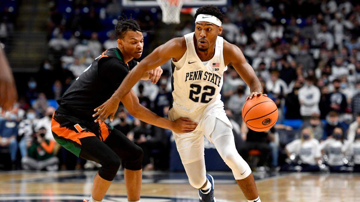 Penn State’s Jalen Pickett dribbles around a Miami defender during the game on Wednesday, Dec. 1, 2021.