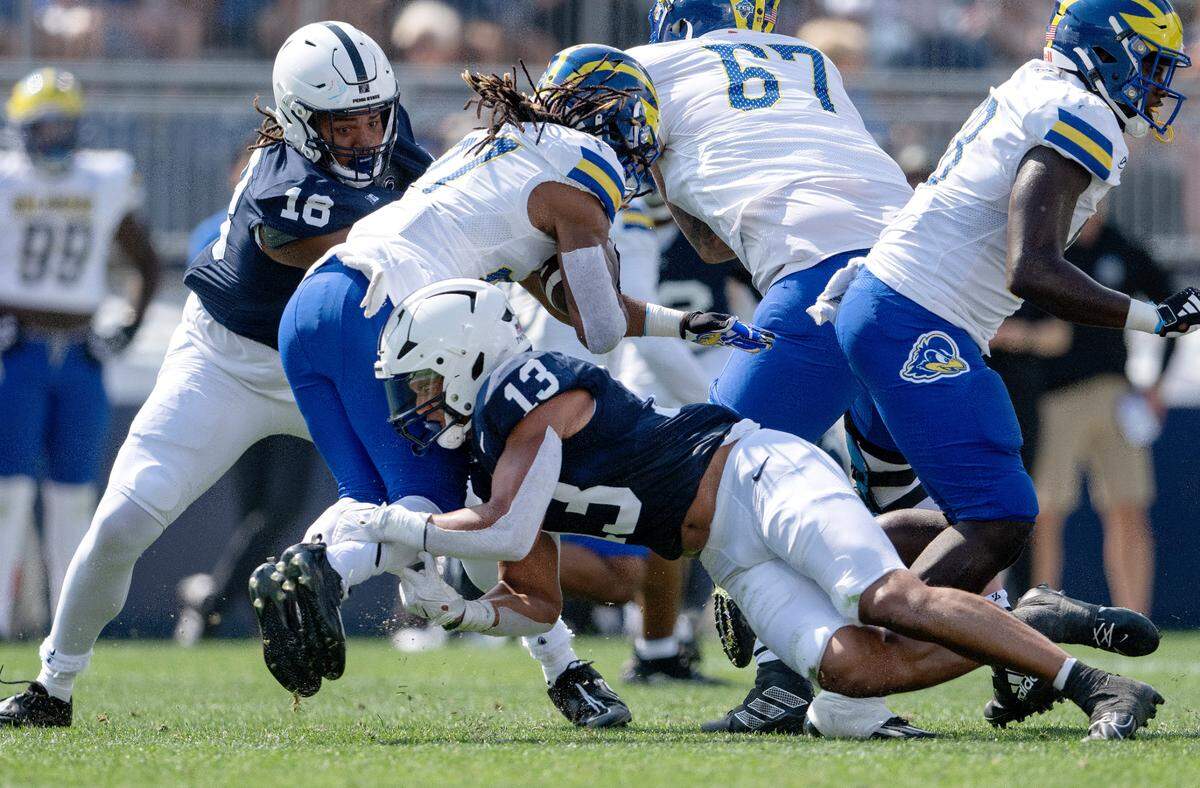 Penn State linebacker Tony Rojas stops Delaware’s Jo’Nathan Silver during the game on Saturday, Sept. 9, 2023.