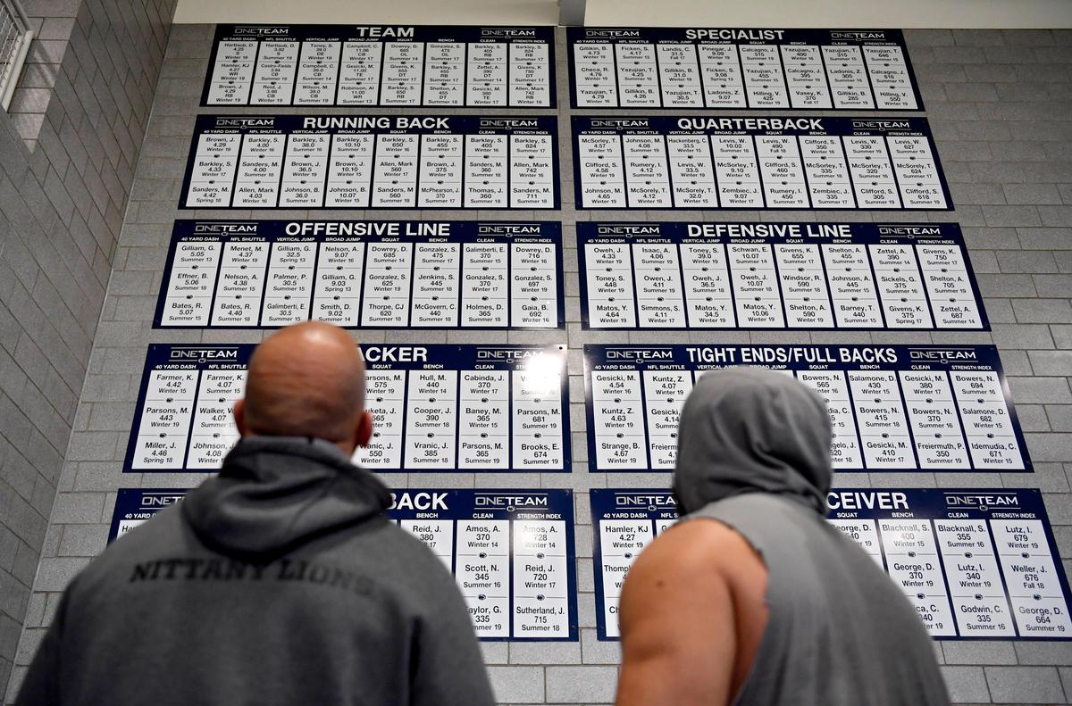 Penn State football coach James Franklin and defensive tackle Antonio Shelton look at the records wall after a weightlifting session on Wednesday, March 4, 2020.