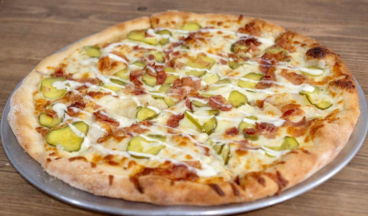 A new speciality pizza, the pickle pizza, featuring pickles, bacon, ranch, crushed red pepper and mozzarella cheese at Streamside Family Restaurant. The restaurant recently moved from Spring Mills and is open at their new location, 2782 Earlystown Road in Centre Hall.