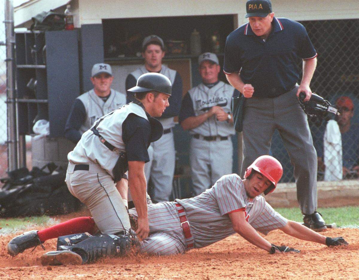 Philipsburg-Osceola’s Jon Condo tags out Central’s Darron Horton at home plate for the final out with the bases loaded in the top of the 5th inning on Monday, May 22, 2000. The game was a District 6 playoff.