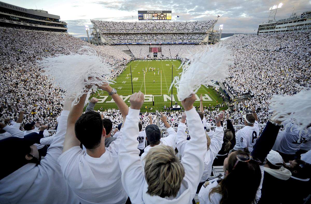 Penn State fans cheer after an interception during the all-stadium White Out against Michigan on Oct. 12, 2013 at Beaver Stadium. The White Out game returns Saturday for a matchup with Iowa.