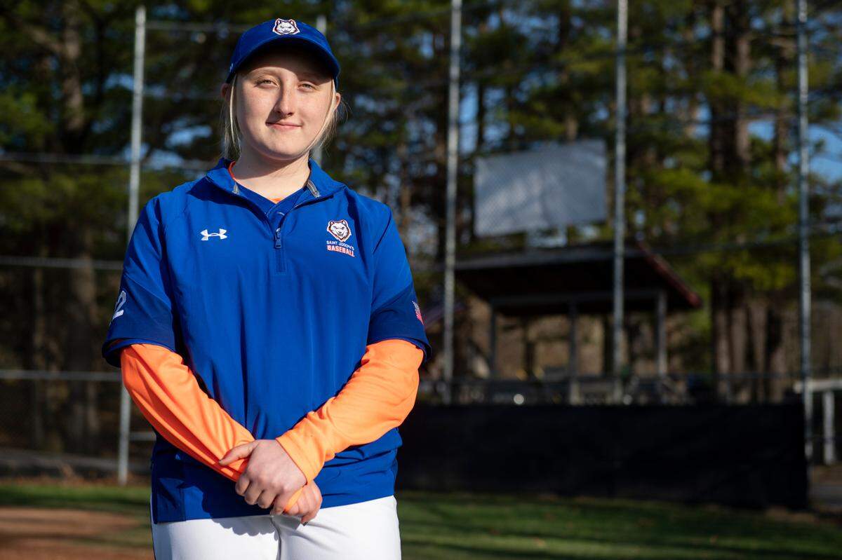 Saint Joseph’s Katie Pase poses for a photo after a PIAA baseball game between Penns Valley and Saint Joseph’s on Wednesday, April 20, 2022 in State College, Pa. After Saint Joseph’s canceled the softball season Pase joined the baseball team to continue to play.