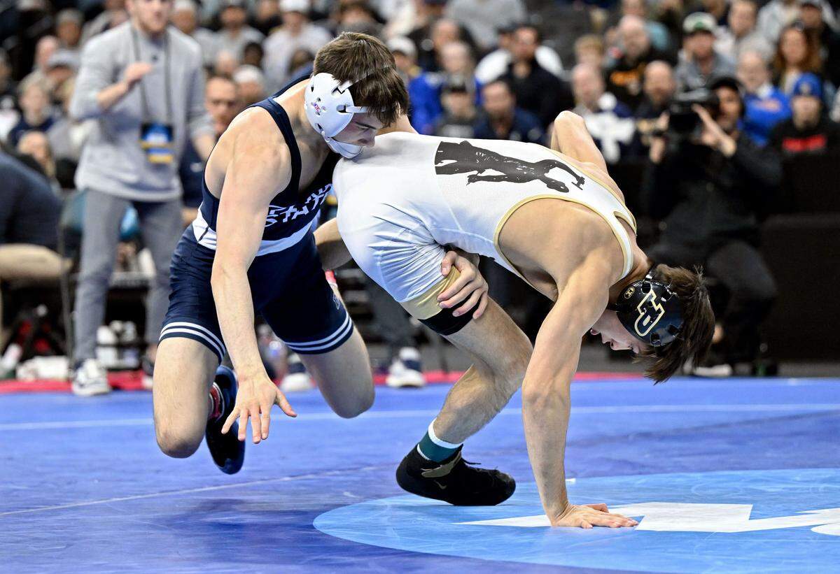 Penn State’s Luke Lilledahl takes down Purdue’s Matt Ramos in the 125-pound third place bout of the 2025 NCAA Wrestling Championships in Philadelphia’s Wells Fargo Center on Saturday, March 22, 2025.