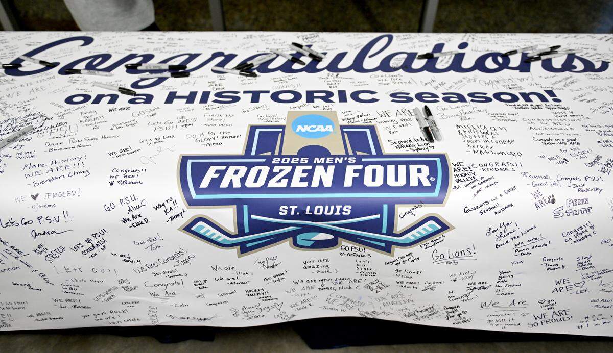 Penn State fans sign a banner for the team during the NCAA Frozen Four watch party at Pegula Ice Arena on Thursday, April 10, 2025.