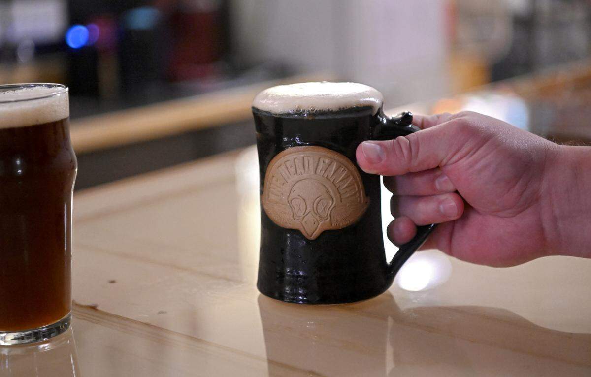 A Use No Hooks hoppy amber ale is served in a founder’s club mug at The Dead Canary Brewing Company in Philipsburg on Thursday, Oct. 19, 2023.