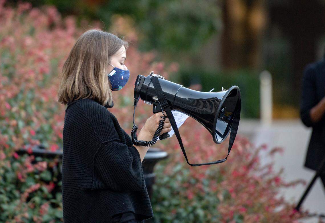 Nora Van Horn speaks during an Oct. 1 rally and march organized by Students Against Sexist Violence.