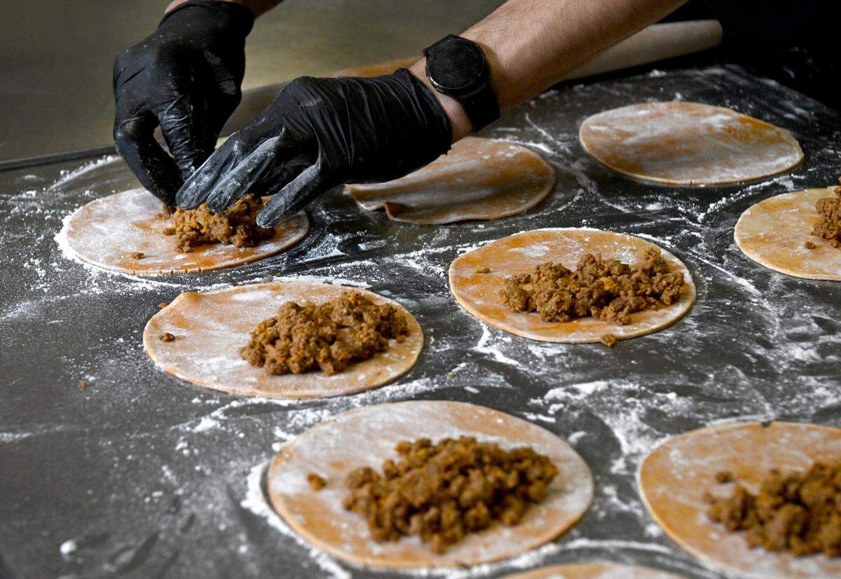 George Salgado makes empanadas for a Puerto Rican themed meal at Tau Kappa Epsilon fraternity on Tuesday, Jan. 16, 2024.