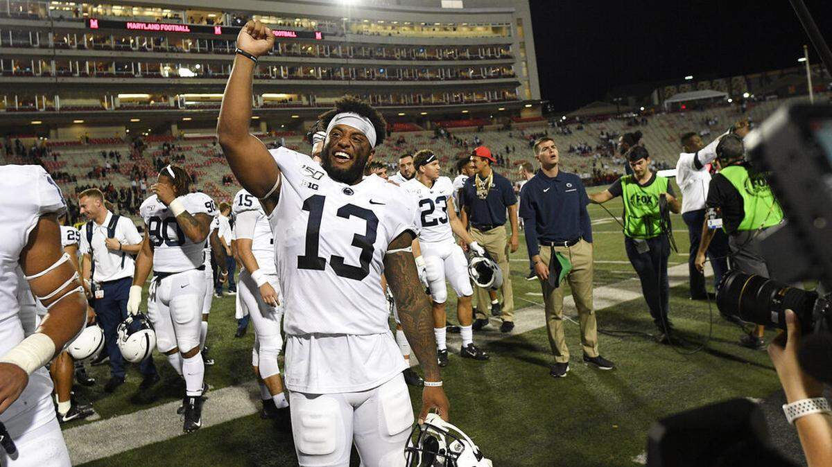 Penn State linebacker Ellis Brooks (13) celebrates after an NCAA college football game against Maryland, Friday, Sept. 27, 2019, in College Park, Md. Penn State won 59-0. (AP Photo/Nick Wass)
