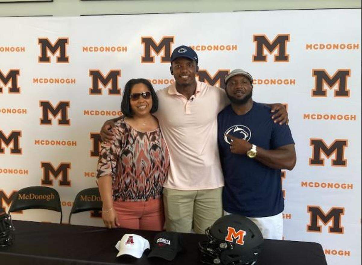 Dani Dennis-Sutton, middle, poses with his parents after committing to Penn State football over Alabama and Georgia on Thursday, July 22, 2021, at The McDonogh School in Owings Mills, Maryland.