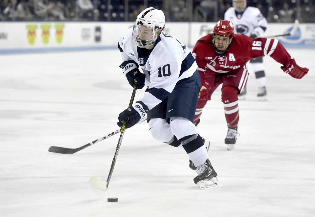 Penn State’s Brandon Biro skates down the ice ahead of Wisconsin’s Tarek Baker during the game at Pegula Ice Arena on Thursday, Oct. 31, 2019.