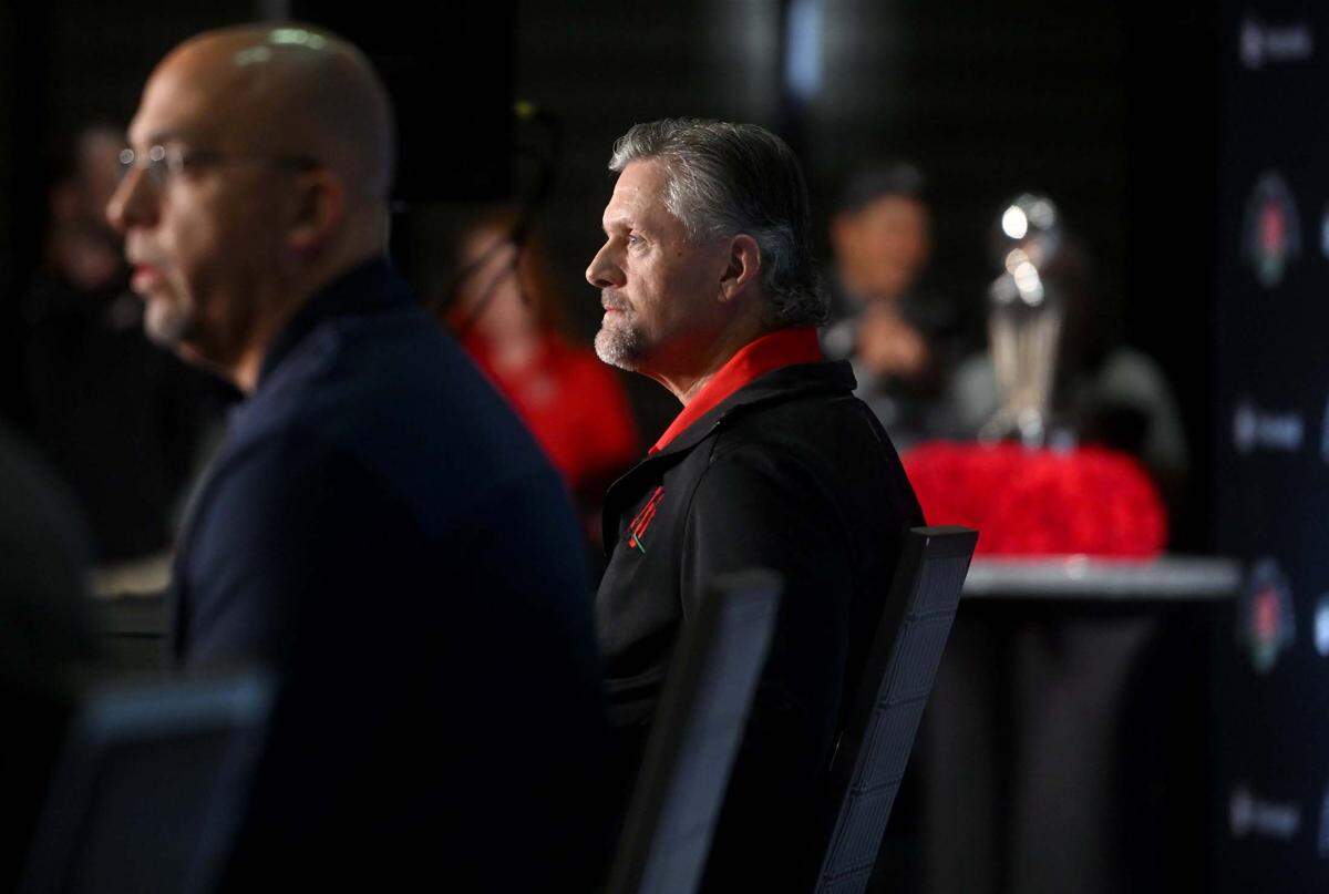 Utah coach Kyle Whittingham listens as Penn State coach James Franklin answers a question during the press conference for the Rose Bowl on Sunday, Jan. 1, 2023.